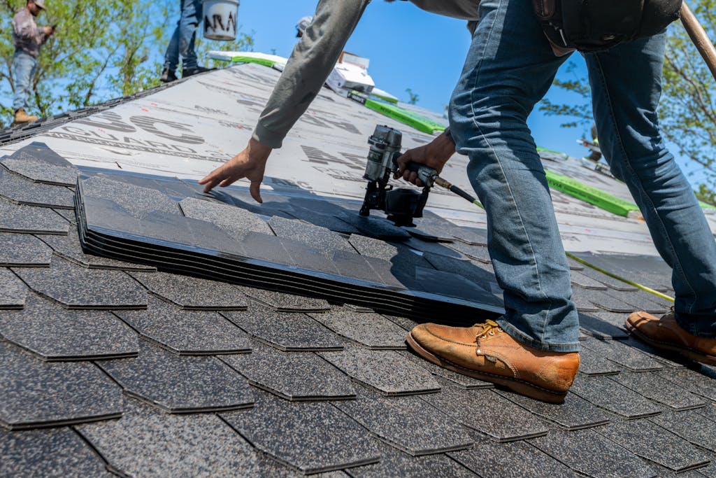 roofing company Calgary man working on the roof